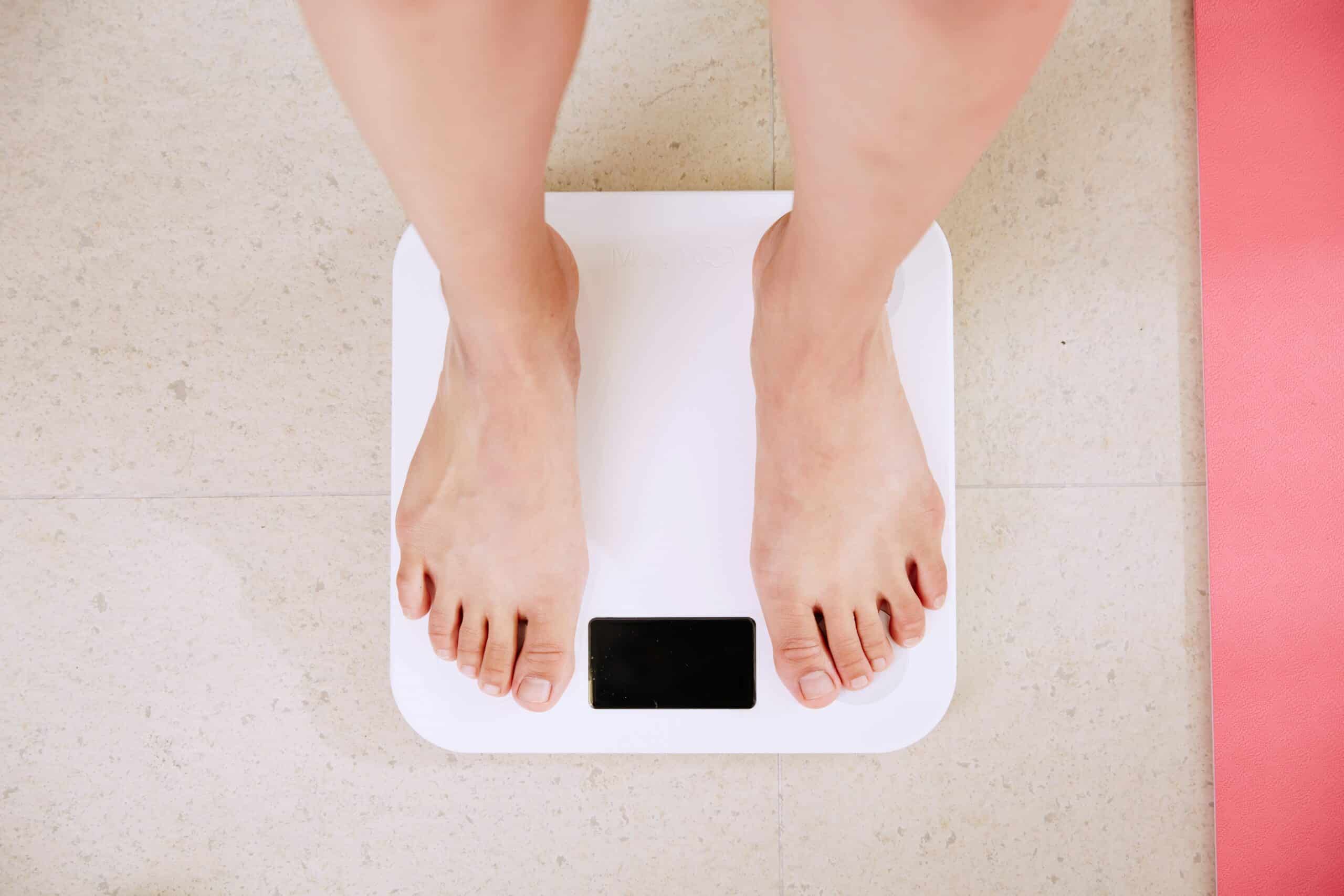 woman standing on scale, no weight shown
